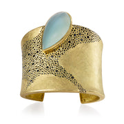Todd Reed cuff bracelet with a Pear cabochon gem silica (~42ct), black brilliant cut diamonds (~9.25ct), and 18k yellow gold.